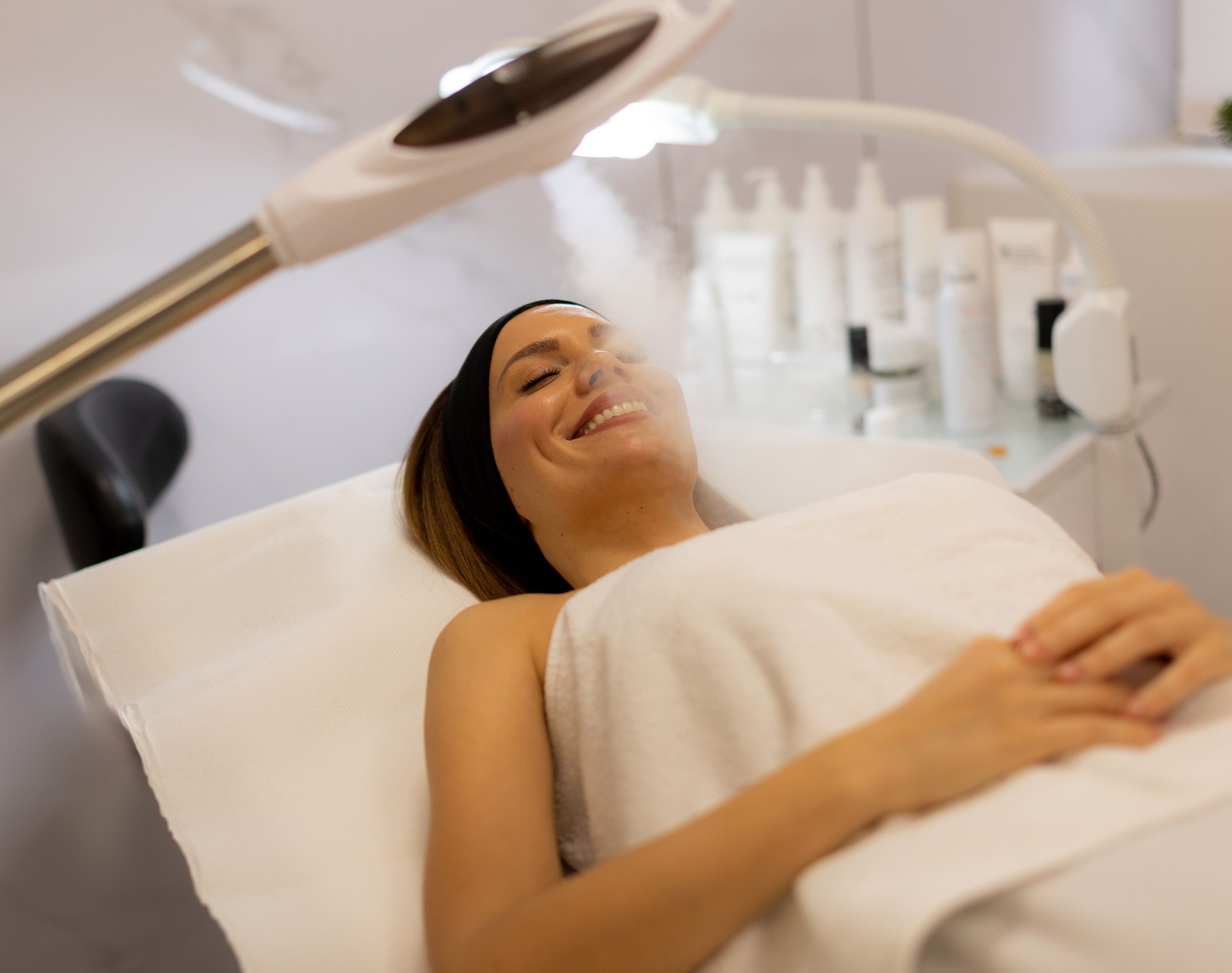 Relaxation and rejuvenation during a soothing facial treatment in a modern spa environment