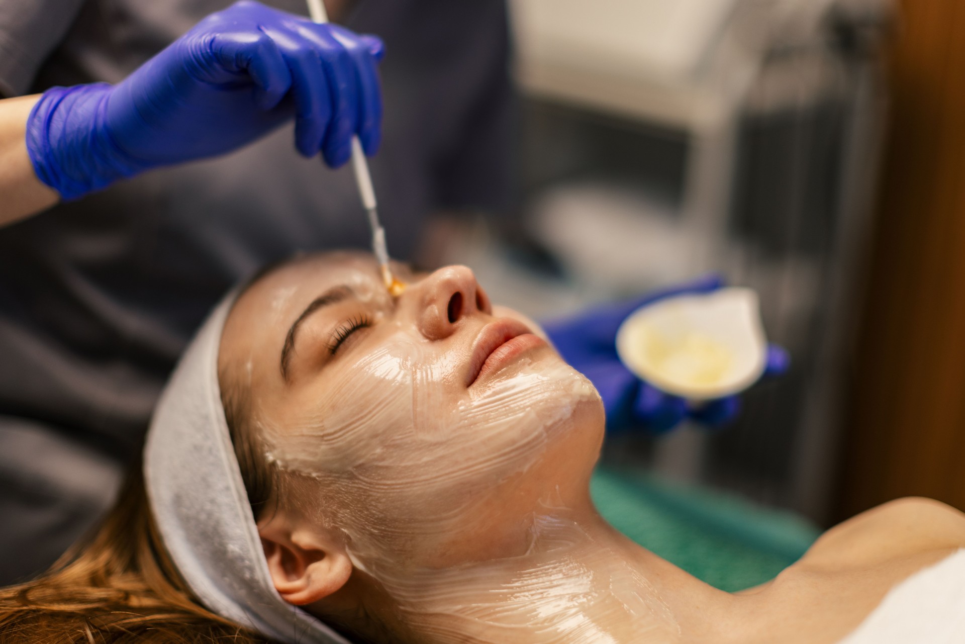 Young woman having a face treatment